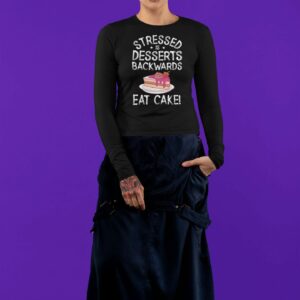 Stressed Is Desserts Backwards Eat Cake Unisex Heavy Blend™ Crewneck Sweatshirt - long sleeve tee mockup featuring an androgynous woman at a studio - Shujaa Designs