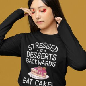 Stressed Is Desserts Backwards Eat Cake Unisex Heavy Blend™ Crewneck Sweatshirt - long sleeve tee mockup of a woman wearing artsy makeup m - Shujaa Designs