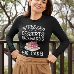 Stressed Is Desserts Backwards Eat Cake Unisex Heavy Blend™ Crewneck Sweatshirt - mockup of a happy middle aged woman wearing a long sleeve tee - Shujaa Designs