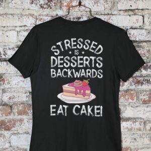 Stressed Is Desserts Backwards Eat Cake Unisex Jersey Short Sleeve Tee - mockup of a round neck t shirt hanged by a brick wall m - Shujaa Designs
