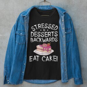 Stressed Is Desserts Backwards Eat Cake Unisex Jersey Short Sleeve Tee - t shirt mockup featuring a denim jacket on top - Shujaa Designs